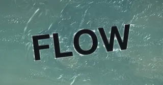 The word Flow acting as an obstacle inside an agitated teal fluid simulation.